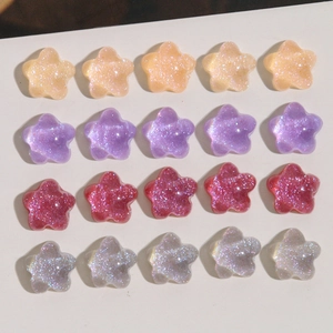 Macro shot of glitter resin star charms in various colors for DIY earring accessories
