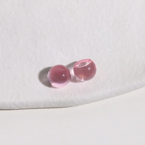 Close-up of 10mm pink translucent resin round beads for DIY jewelry and hair accessories