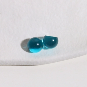 Macro shot of 10mm clear blue jelly resin round cabochon for DIY jewelry making