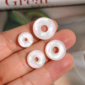 Set of four iridescent white pearlescent round rings for DIY jewelry making