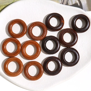 Set of ten geometric hollow wooden rings for DIY earring crafts in light and dark brown tones