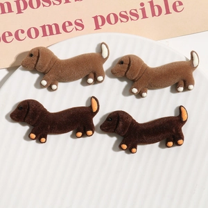 Detailed view of flocked dachshund resin charms for DIY hair accessories and crafts