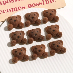 Brown flocked bear resin accessories for DIY jewelry in 3x3 grid display on ceramic plate