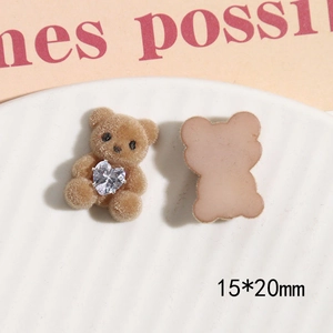 Detail view of 15x20mm flocked bear resin patch with heart rhinestone for DIY crafts