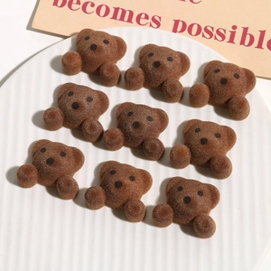 Close-up of brown flocked bear resin charms for DIY hair accessories and crafts