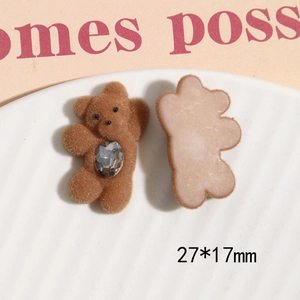 Close-up of brown flocked bear DIY accessory with rhinestone detail, size 27x17mm