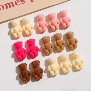 Detailed macro view of multi-colored flocked cartoon bears for DIY jewelry and hair clips