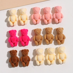 Detailed view of colorful mini flocked resin bears for DIY hair accessories and jewelry