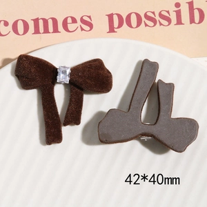 Close-up of brown velvet bow hair clips with rhinestones and metal fasteners, 42*40mm