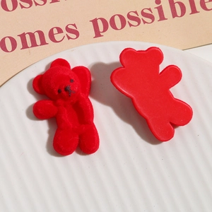 Detail shot of red flocked bear charms for DIY jewelry and hair accessories craft