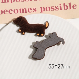 Detail of brown flocked dachshund DIY charms showing front texture and flat back surface