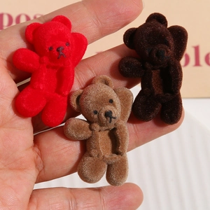 Macro detail of three-color flocked bear charms with soft texture for DIY accessories