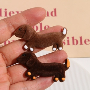 Detailed view of flocked dachshund animal patches in brown for DIY craft accessories