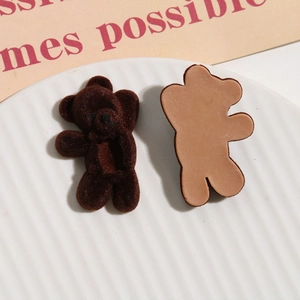 Detailed view of brown flocked bear DIY patches showing front texture and flat back side