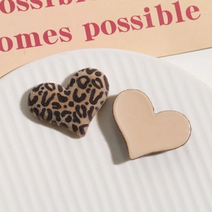 Detail of heart-shaped leopard print flocked charms for DIY jewelry and hair accessories