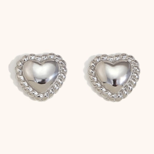 Polished silver heart stud earrings with twisted rope border and vintage aesthetic style