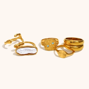 Bohemian gold-plated ring set featuring a baroque pearl, sun pattern and blue gemstones