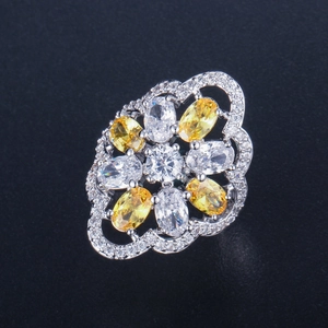Macro detail of vintage floral ring with AAA zircon inlay and yellow oval gemstones