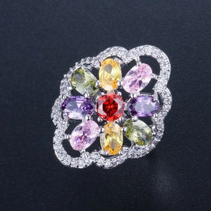 Detailed macro view of floral ring with multi-color gemstones and inlaid AAA zircons