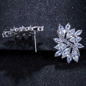 Close-up of sparkling marquise-cut zircon flower earrings with silver-plated setting