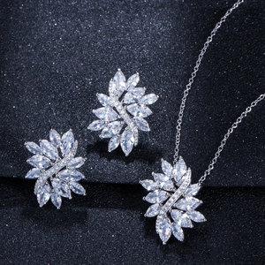 Macro view of crystal marquise zircon feather pendant and earring jewelry set details