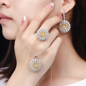 Elegant silver sunflower jewelry set with yellow pear-cut stones and white zircons