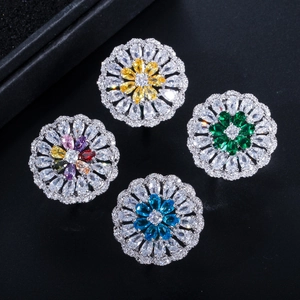 Exquisite flower-shaped jewelry set with colorful zircon stones on black background