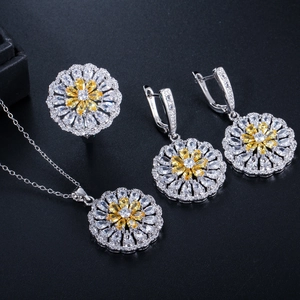 Close-up of flower zircon jewelry set with yellow pear gems and silver plating