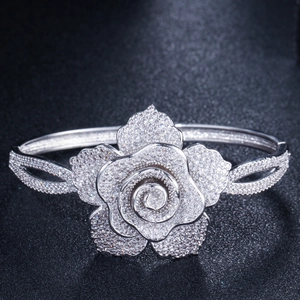 Macro detail of silver floral bangle featuring pavé-set sparkling zircon rose petals