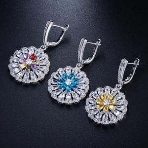 Detailed macro view of S925 sterling silver floral earrings with colorful zircon gemstones