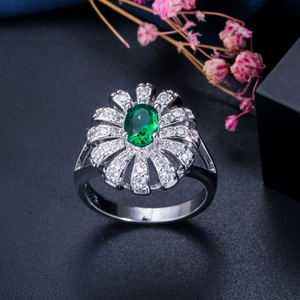 Exquisite flower ring with oval green gemstone and micro-pave cubic zirconia petals