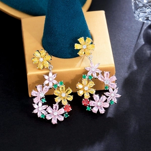Detailed close-up of S925 silver floral drop earrings with multicolored zircon crystals