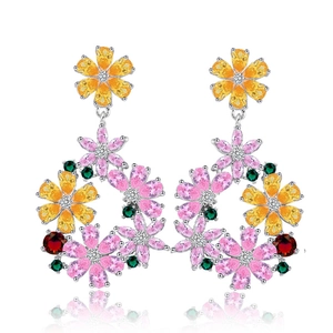 Macro detail of silver floral drop earrings with colorful zircon stones and floral wreath