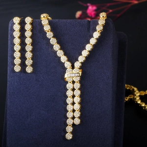 Gold plated bridal necklace and drop earrings set with shimmering cubic zirconia