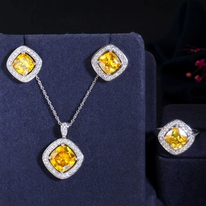 Detail of luxury square yellow zircon jewelry set including necklace, earrings and ring