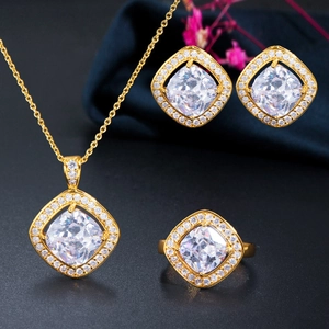 Detailed view of 3-piece jewelry set featuring square zircon stones and gold plating