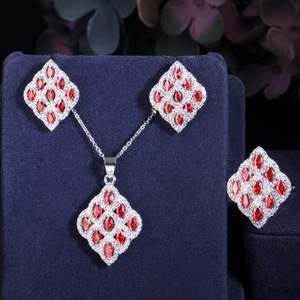 Elegant silver jewelry set with marquise-cut red stones and halo diamond accents