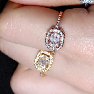 Macro view of micro-pave baguette zircon rings in gold and rose gold plating