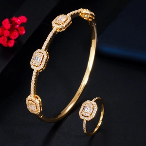 Elegant gold plated bangle and ring set with pavé zircon stones and geometric design