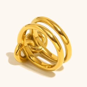Detailed view of polished 18K gold plated knotted multi-layer ring with glossy finish