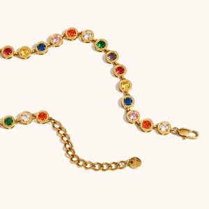 Detailed macro view of rainbow cubic zirconia bracelet in 18K gold plated stainless steel