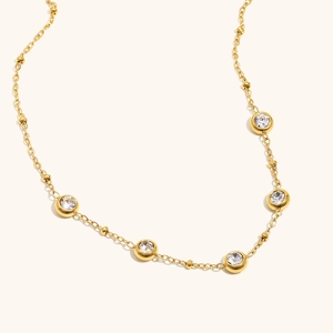 Minimalist 18K gold plated stainless steel necklace with five bezel-set round zircons