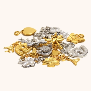 Selection of stainless steel gold and silver pendants with swallow clover and heart charms