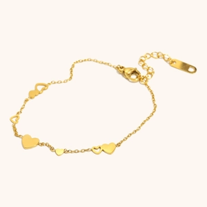 Bracciale minimalista in acciaio placcato oro 18K con ciondoli a cuore pieni e traforati