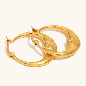 Abstract moon face earrings in 18K gold plated stainless steel with embossed detail