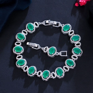 Macro shot of silver-plated oval green gem bracelet with micro-pave zirconia details