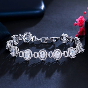 Macro view of silver bracelet with oval cut stones and pave-set zircon details