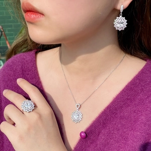 Sunflower style jewelry set with ruby and zircon necklace, earrings and ring on model