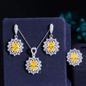 Detail of luxury jewelry set with yellow oval stones and zircon floral pattern