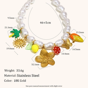 Baroque pearl necklace with 18K gold plated charms like strawberry and flower